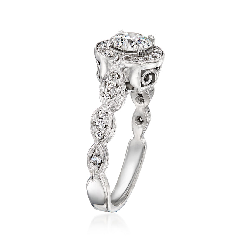 Vintage white gold diamond ring side view with round center stone and scroll settings