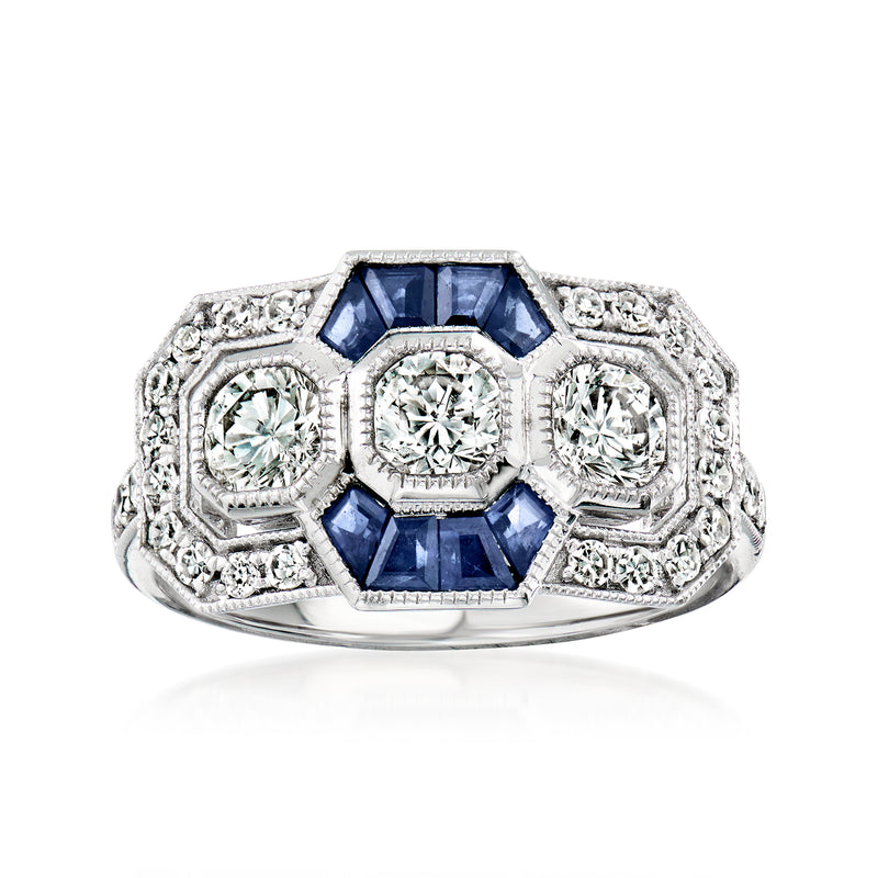 Platinum ring with blue sapphire center and diamond side clusters, vintage setting