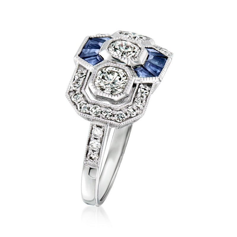 Platinum diamond and sapphire ring, angled view with blue side stones and halo