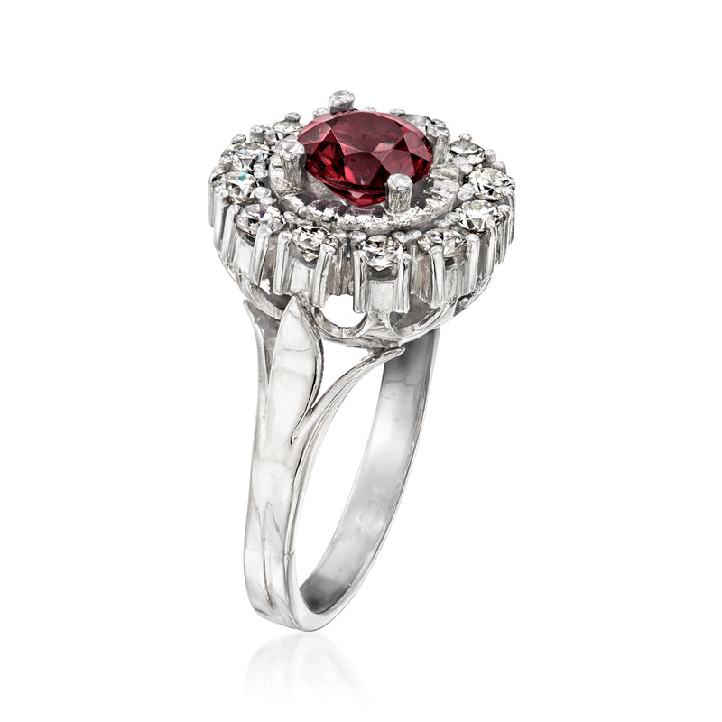 Platinum ring side view with round red center stone and diamond halo