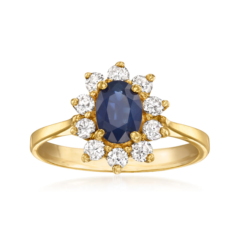14kt yellow gold ring with oval blue sapphire and round diamond halo