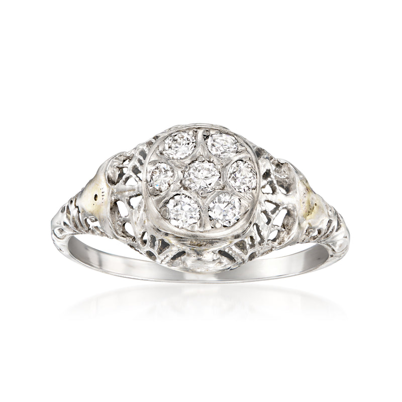 White gold diamond cluster filigree ring with oval center and round stones