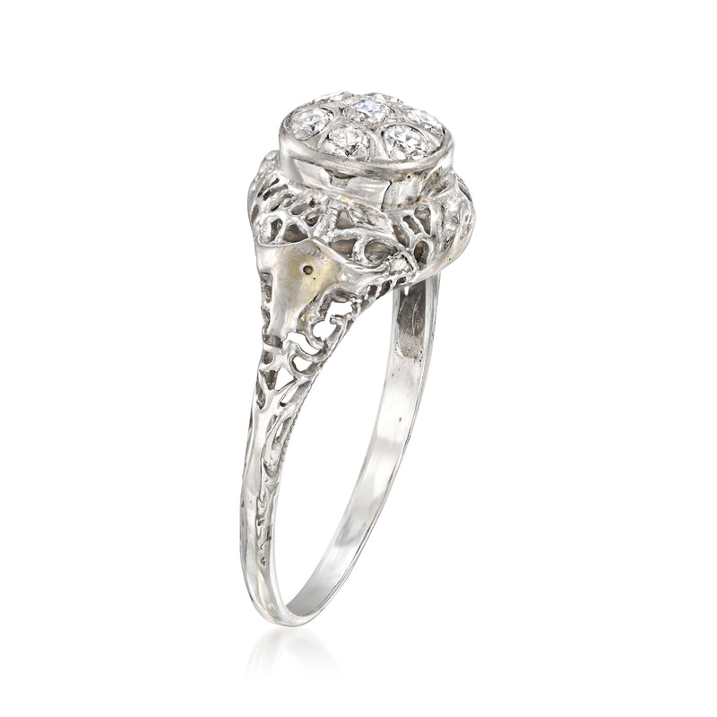 White gold diamond cluster filigree ring, raised oval top setting