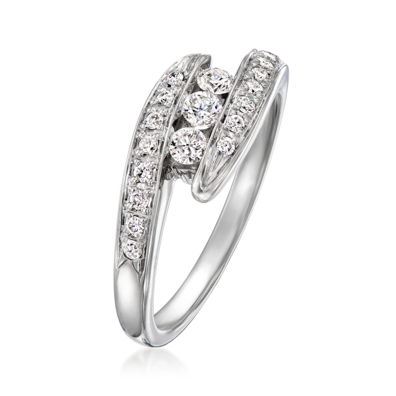 Vintage 14kt white gold diamond bypass ring with pavé and three center stones