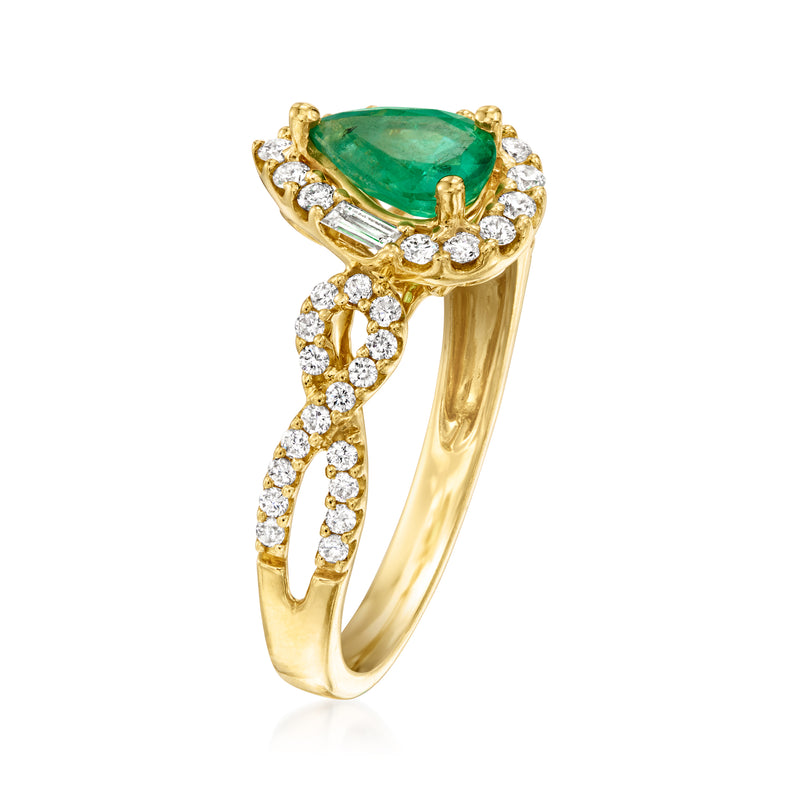 14kt yellow gold ring with pear emerald center, diamond baguette and round accents
