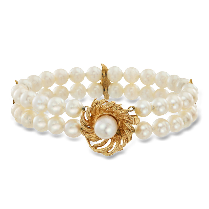 Two-strand cultured pearl bracelet with 14kt yellow gold leaf clasp and round pearl center