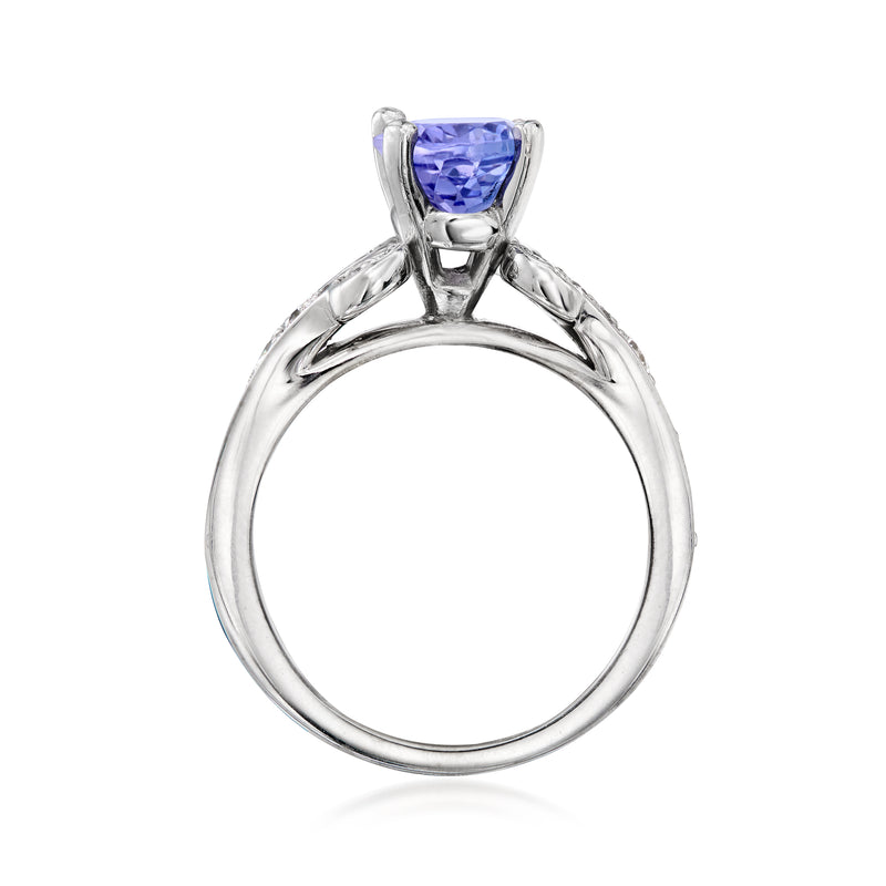 18kt white gold ring with oval blue gemstone in four-prong setting