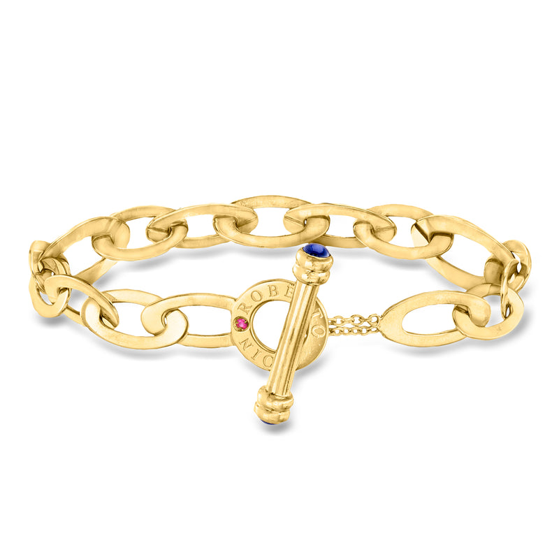 18kt yellow gold oval-link bracelet with toggle clasp, blue and red synthetic stones