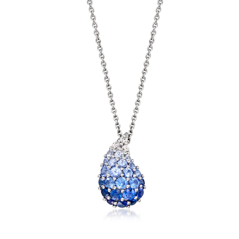 Tonal blue teardrop sapphire pendant on silver-toned chain with diamond accents