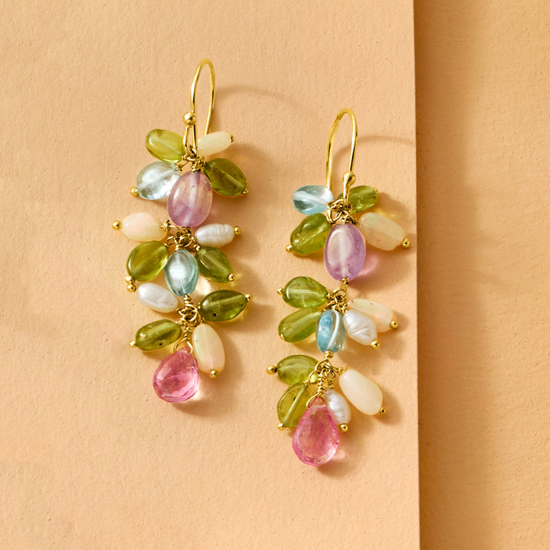 Gold drop earrings with clustered pastel gems, pearl accents, and opal-like beads