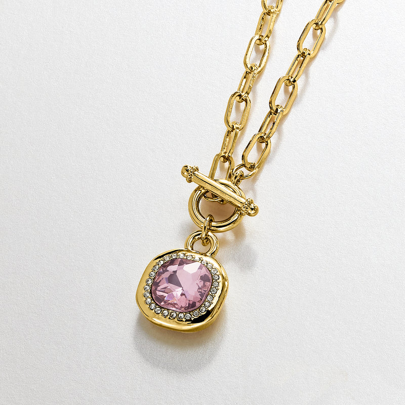 Gold-plated toggle necklace with pink oval gemstone in crystal halo