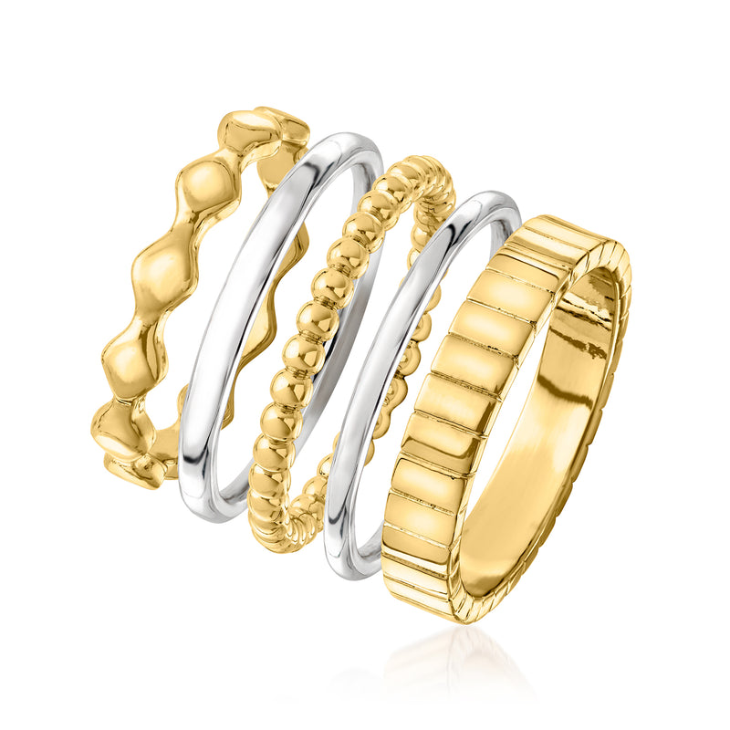 Five stackable rings with gold textured bands and smooth silver bands in a layered view
