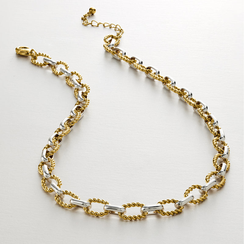 Silver and gold-plated link necklace, flat lay with adjustable chain end