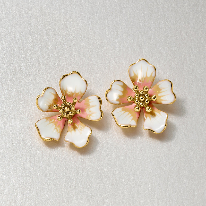 Gold-plated flower stud earrings with white enamel petals and pink dot center