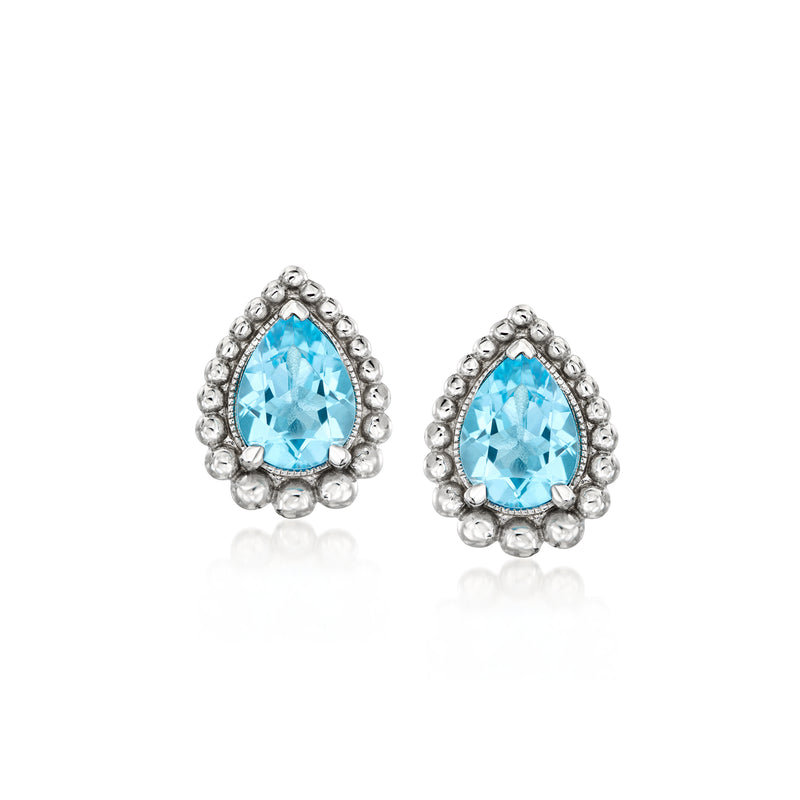 Sterling silver teardrop blue topaz stud earrings with beaded halo, post back