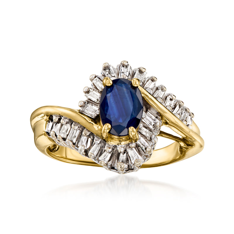 Yellow gold vintage swirl ring with oval deep-blue sapphire and diamond halo