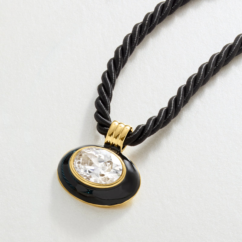 Black cord necklace with oval black-enamel pendant and round CZ stone in gold bezel