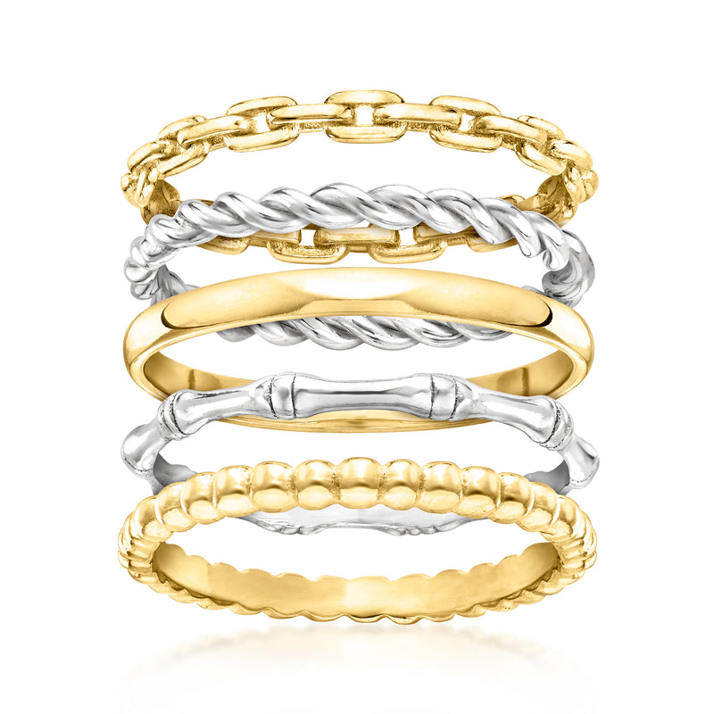Stackable rings set with gold, silver, and bead-textured bands in mixed metals