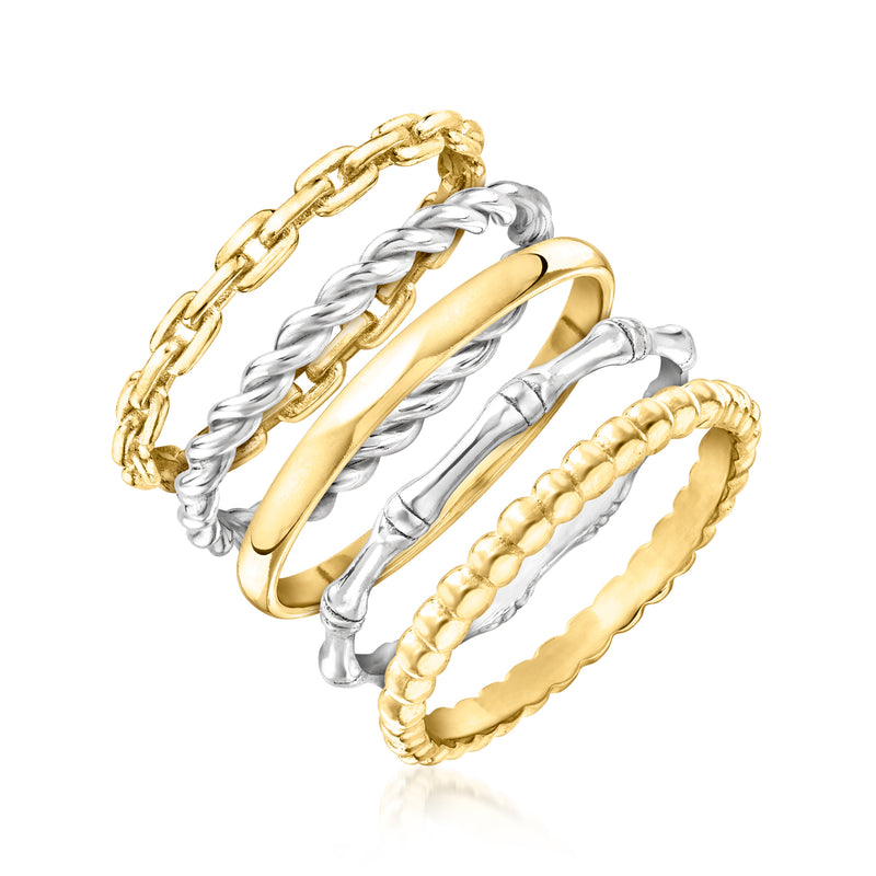 Five stackable rings in gold and silver with chain-link, rope, and scalloped textures