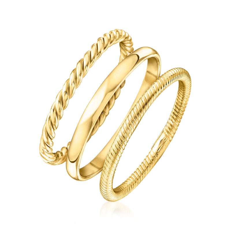 Stackable ring set with one smooth gold band and two twisted rope-texture gold bands.
