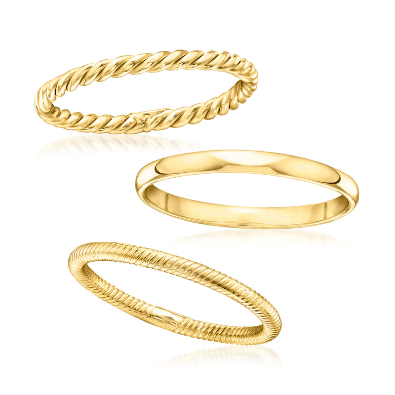 Three gold-tone stackable rings shown separated: braided rope bands and a smooth band.