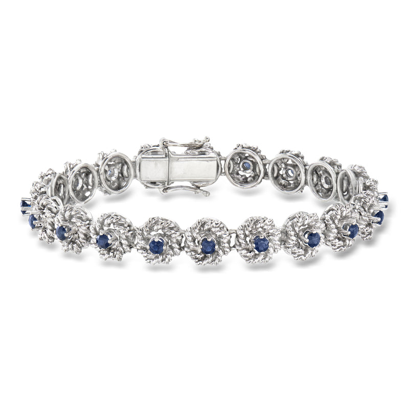 White gold sapphire roped-edge bracelet with round blue stones and ornate circular links
