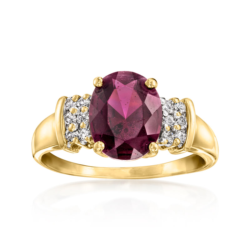 14k yellow gold garnet and diamond ring with oval center and side diamond clusters
