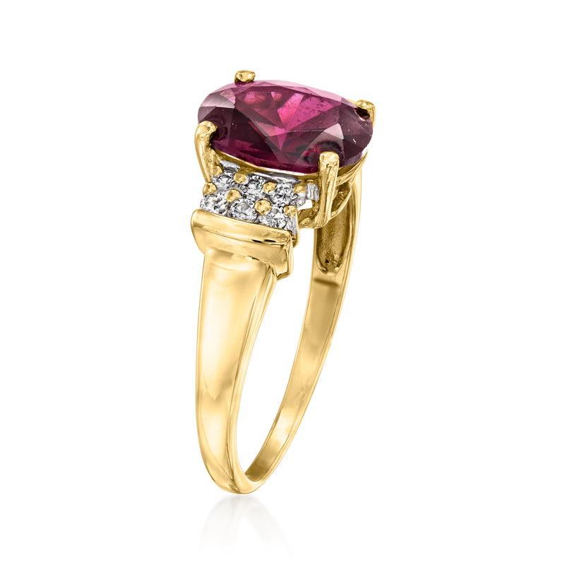14k yellow gold ring with oval pink garnet center and diamond band accents, side view