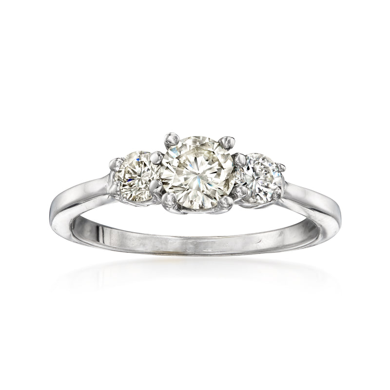 Three-stone diamond ring in 14kt white gold, oval center stone with side diamonds