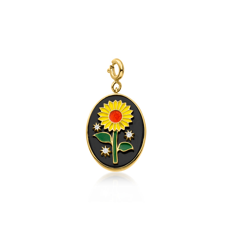 Gold charm pendant with black enamel sunflower, green leaves, red center and sparkle stones