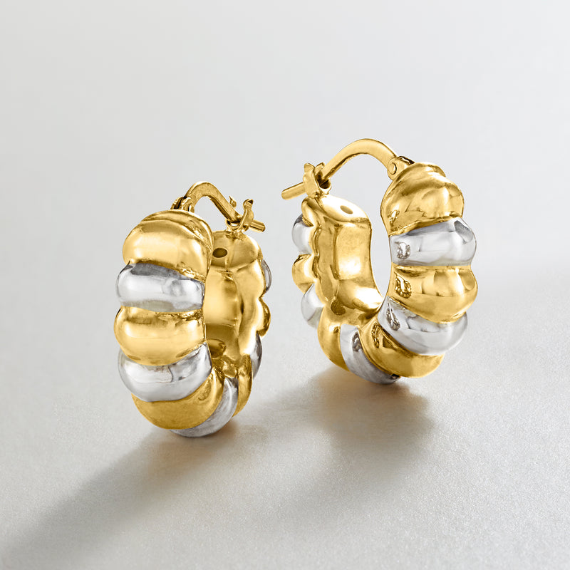 Pair of gold-and-silver ribbed hoop earrings, round profile, hinged backs