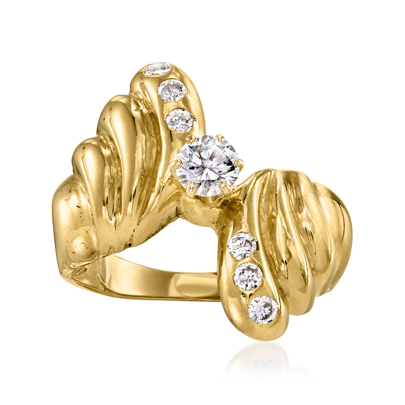 Yellow gold bypass ring with round diamonds across top and three along shank