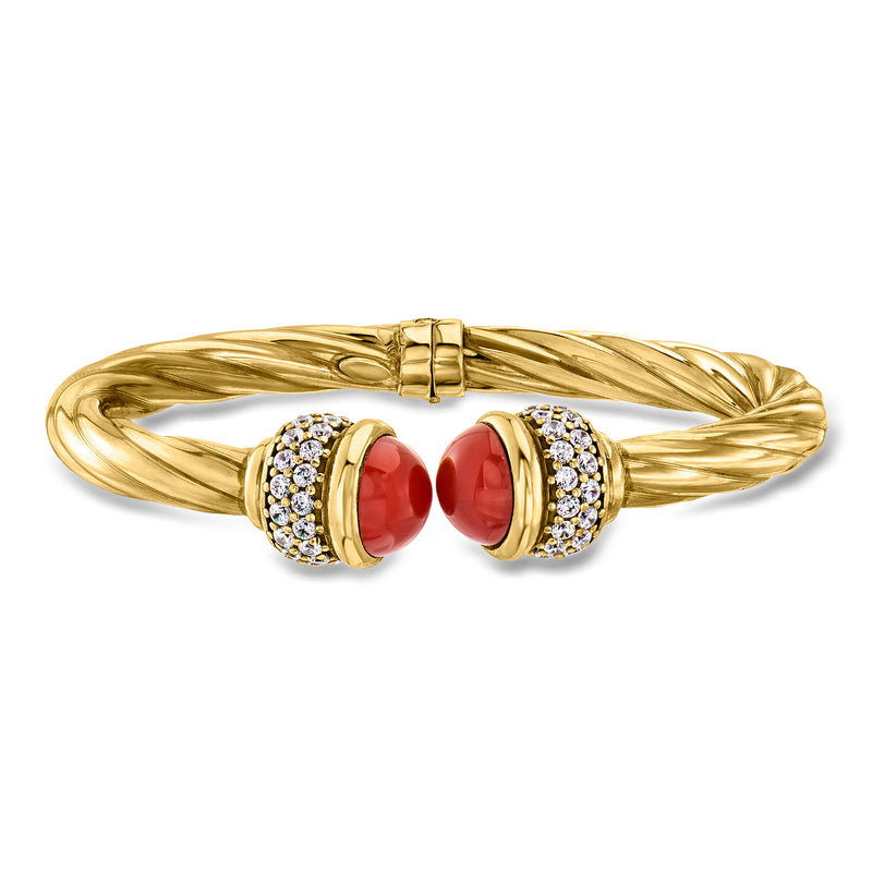 Gold-tone twisted cuff bracelet with red oval cabochons and clear crystal accents