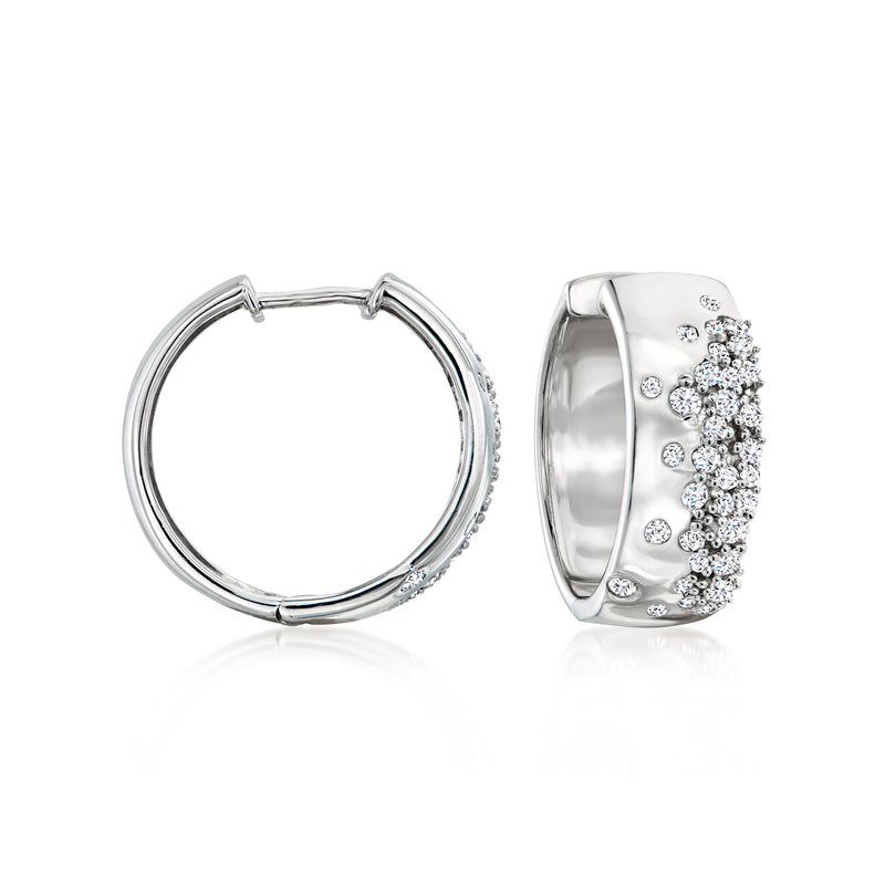 Sterling silver hoop earrings with scattered diamond accents