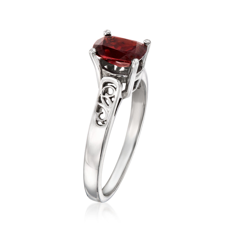 14kt white gold ring with red garnet oval center and decorative openwork shoulders