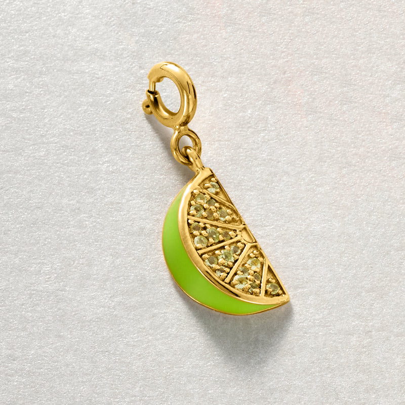 Lime wedge charm in 18kt gold over sterling with green enamel and peridot accents