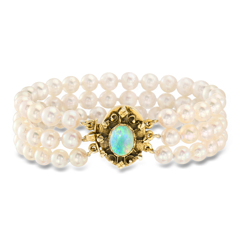 Three-row cultured pearl bracelet with round opal center in 14kt yellow gold