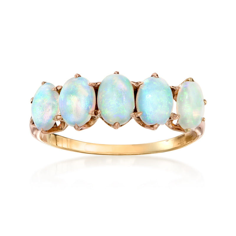 Opal five-stone ring in rose gold with oval light blue opal cabochons