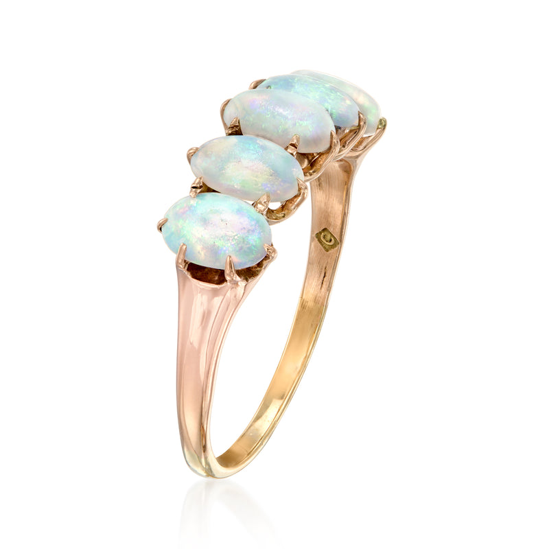 Five-stone opal ring with side profile: rose-gold band and oval light opal stones