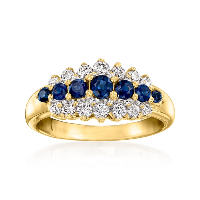 Vintage yellow gold ring with dark blue sapphires and round white diamonds, high setting