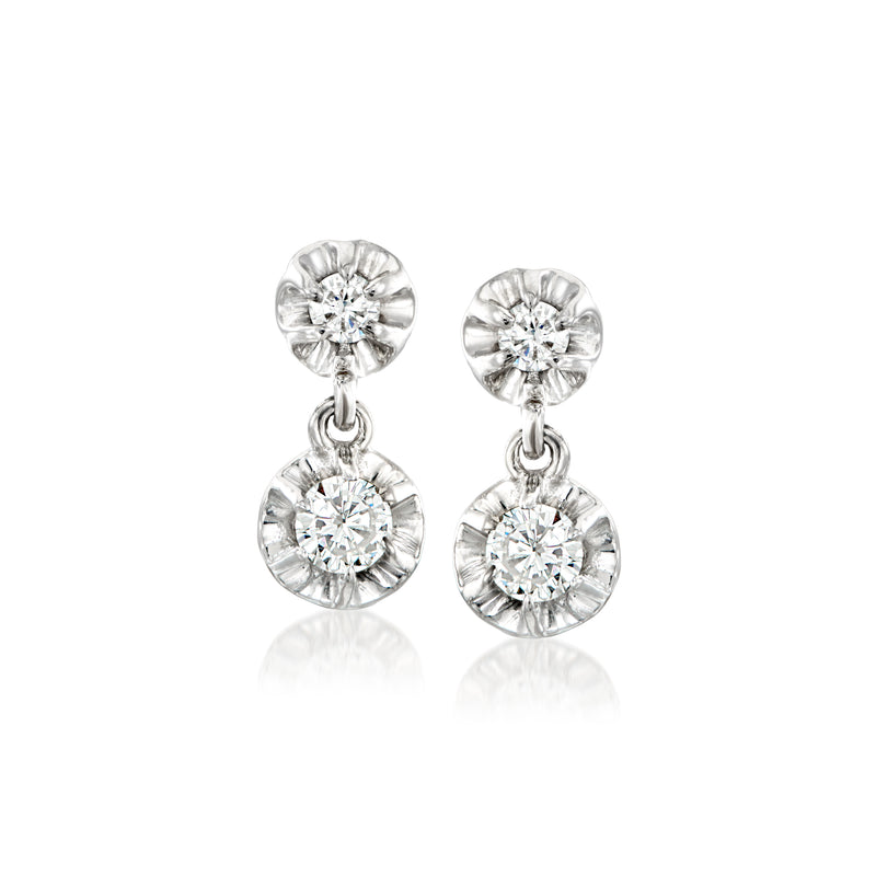 Vintage diamond drop earrings with round center stones and dangling halos in white gold.