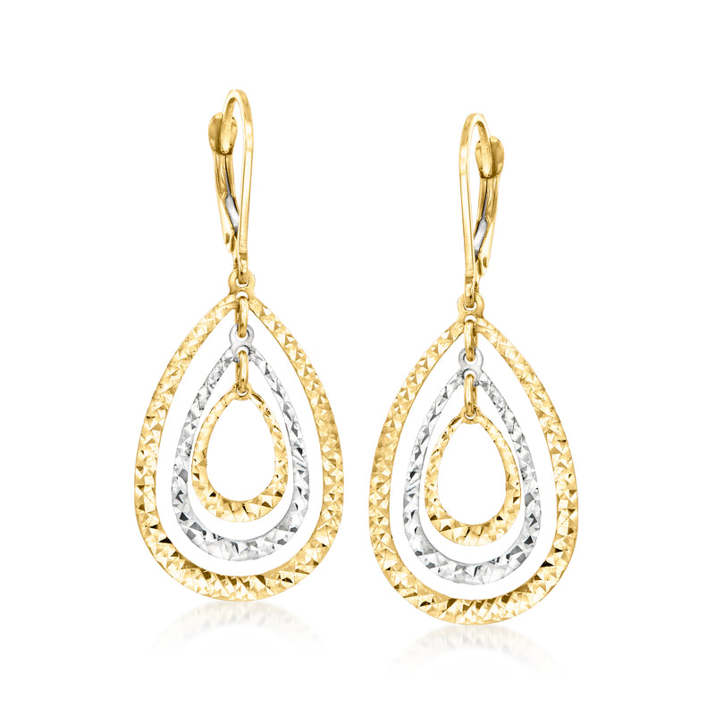 Two-tone gold teardrop earrings with concentric oval rings and textured borders
