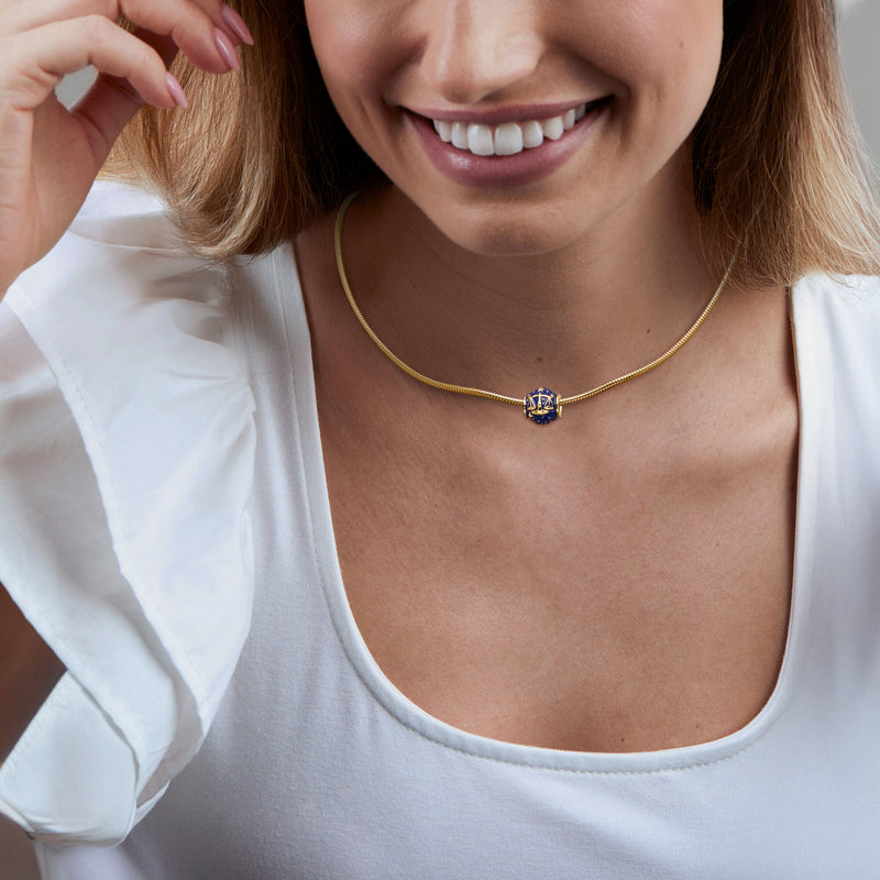 Blue enamel zodiac bead charm on a gold-tone chain necklace