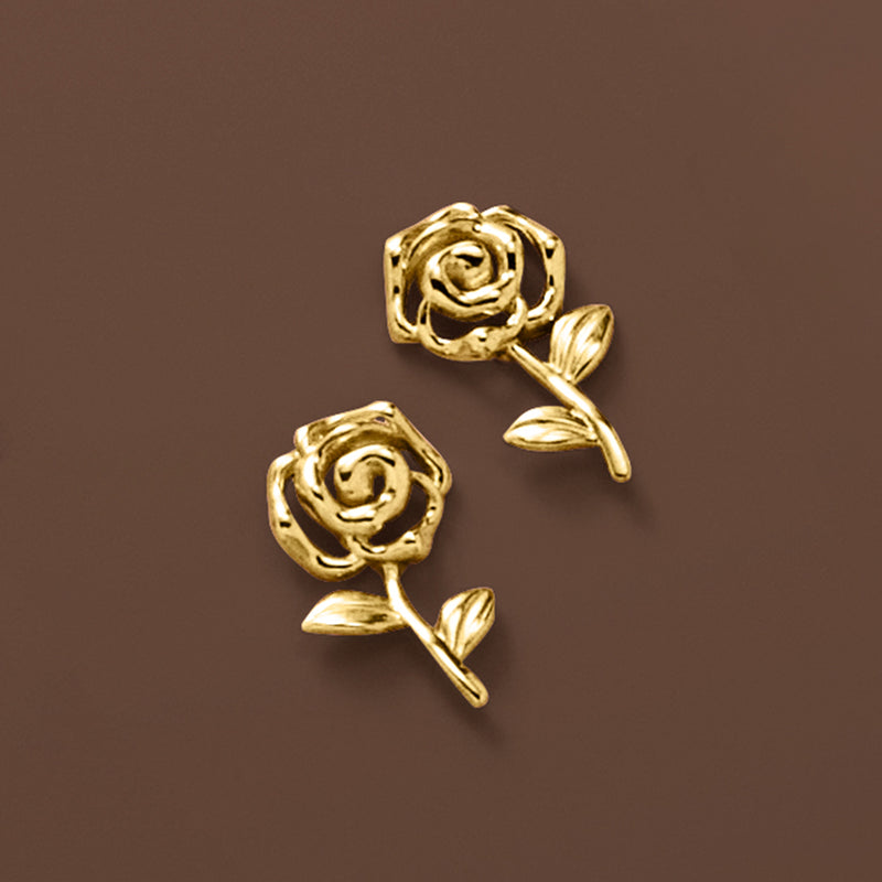Close-up of yellow gold rose stud earrings with leaf details