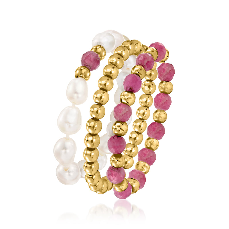 Set of three stretch rings: white pearls and pink stones on yellow gold beads