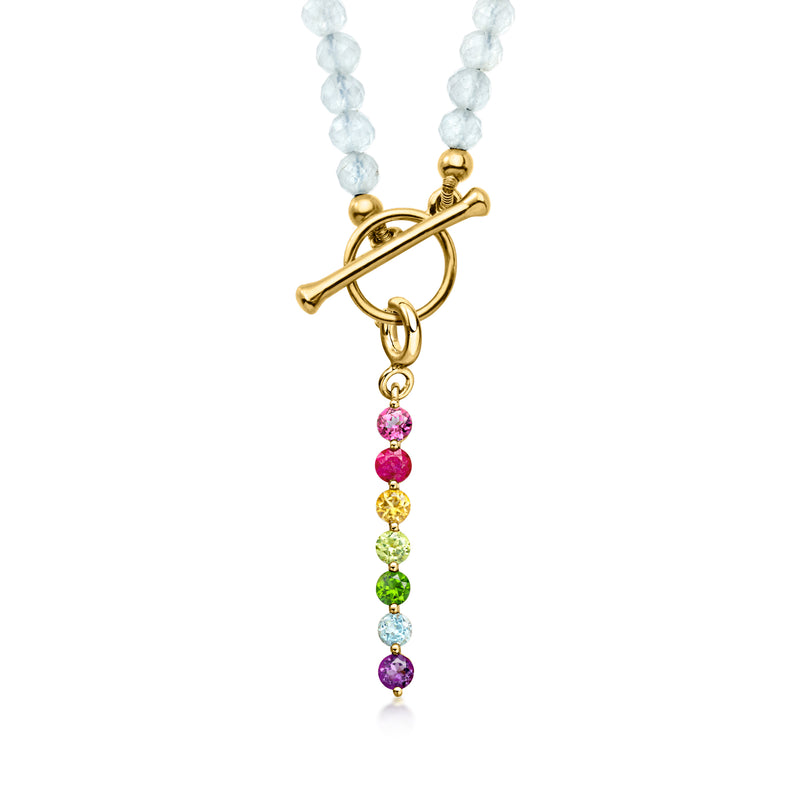 Gold charm with multicolor gemstone drops and light blue beaded strand