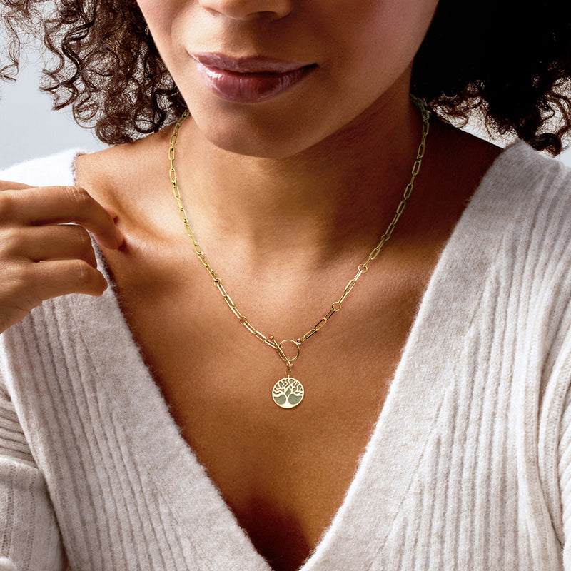 Gold necklace with small Tree of Life charm pendant and round blue-green cabochon