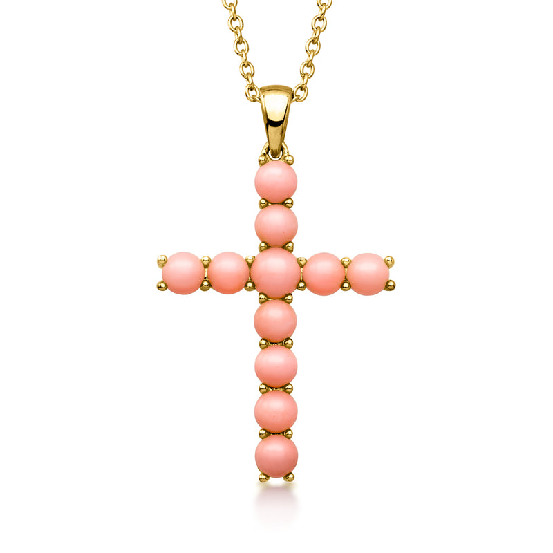 Gold cross pendant necklace with pink coral bead links on a chain