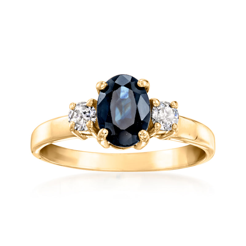 Vintage oval sapphire and diamond ring in 14kt yellow gold, halo with side diamonds