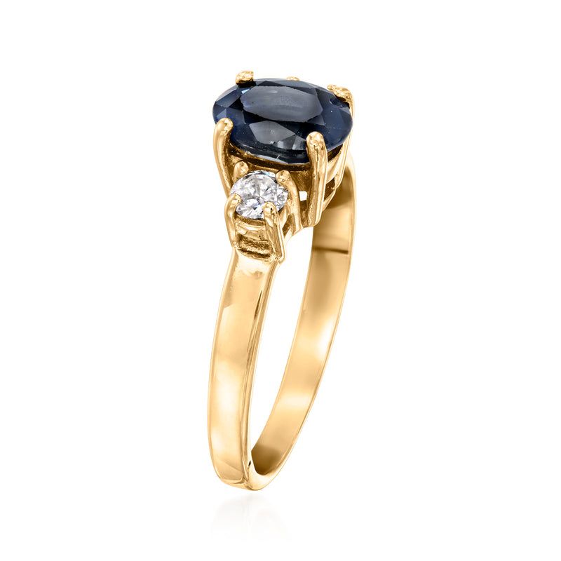Vintage oval sapphire ring in 14kt yellow gold with split prong setting and side diamonds